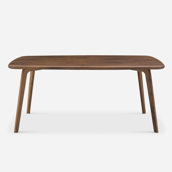 1. Castlery solid American walnut dining table with rounded rectangular top and angled legs, viewed from the front.