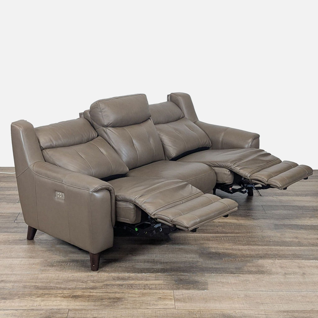 2. Angled view of Campania leather 3-seat power sofa, showing extended recline and side control panel.