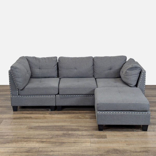 1. Gray Amazon sectional sofa with decorative trim, featuring plush cushions and a moveable chaise ottoman.
