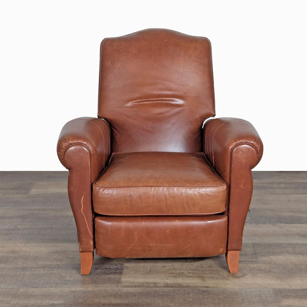 1. Front view of a brown leather push-back recliner lounge chair by Ethan Allen, featuring a transitional design.