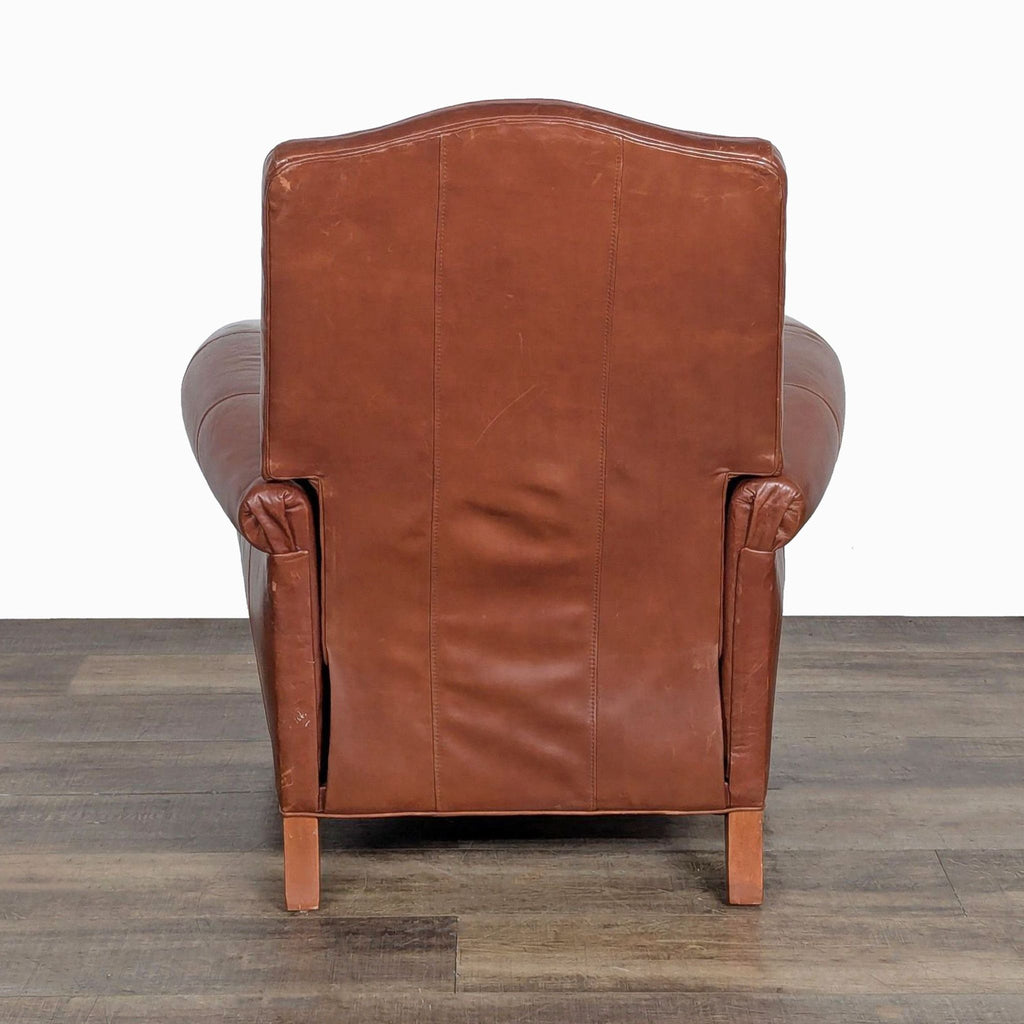 3. Rear angle of the Ethan Allen transitional leather lounge chair, displaying its smooth brown leather upholstery.