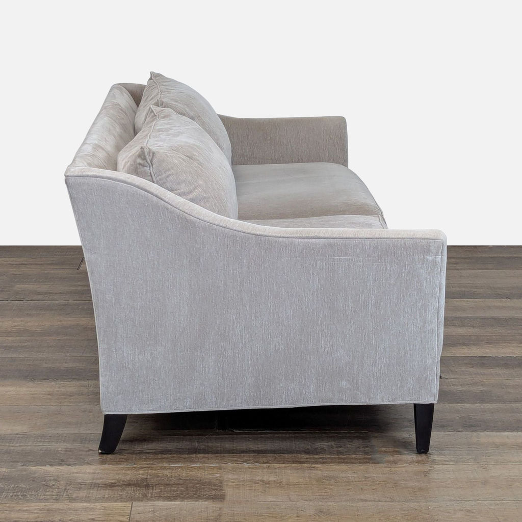 2. Side profile of a Crate and Barrel 3-seater sofa, showcasing chenille fabric and curved arm design.