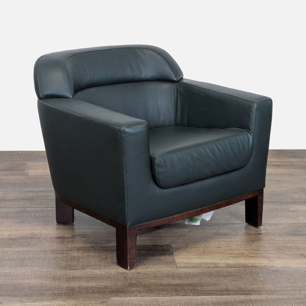 3. Angled view of a Bernhardt lounge armchair, featuring clean lines, boxy arms, and mid-century modern wood legs.