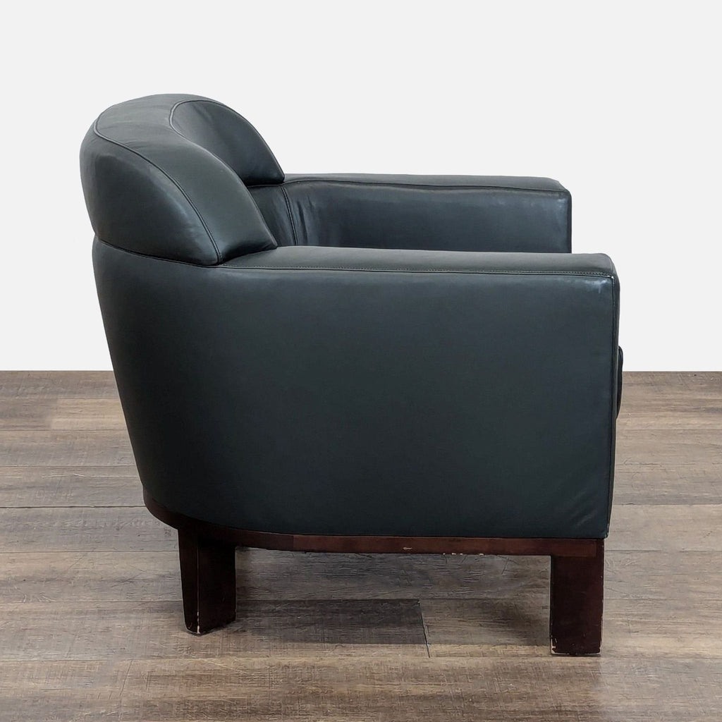 2. Side view of a Bernhardt lounge chair showing sleek boxy arms and sturdy tapered wooden legs with mid-century influence.