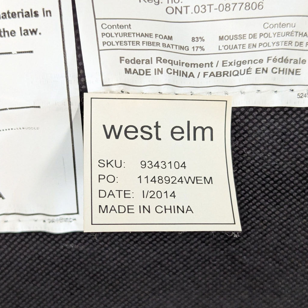 3. Product label showing "west elm," SKU 9343104, made in China, attached to dining chair.