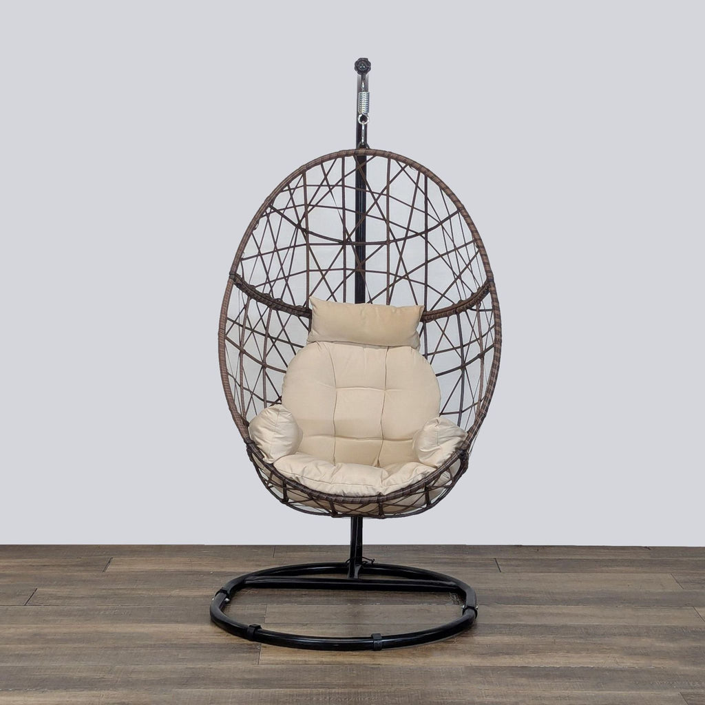 1. Front view of Reperch rattan-style egg chair with weather-resistant cushion and metal stand, for indoor/outdoor use.