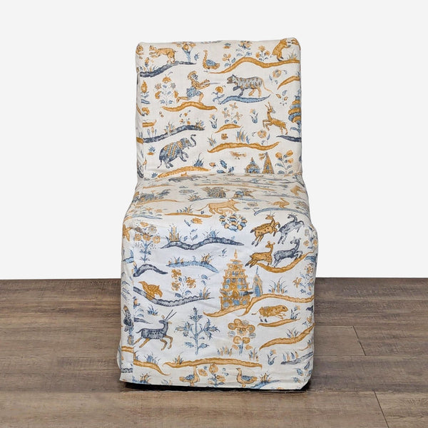 1. Front view of a Restoration Hardware slip covered chair with caster wheels and a whimsical animal print.