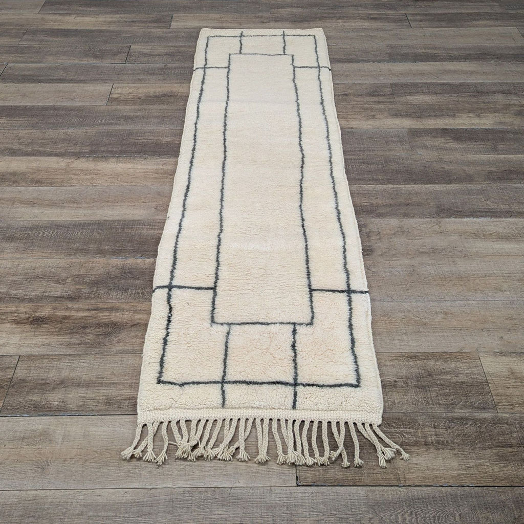 1. Beni Ourain handwoven runner rug made of natural unbleached wool with a geometric black line design.  