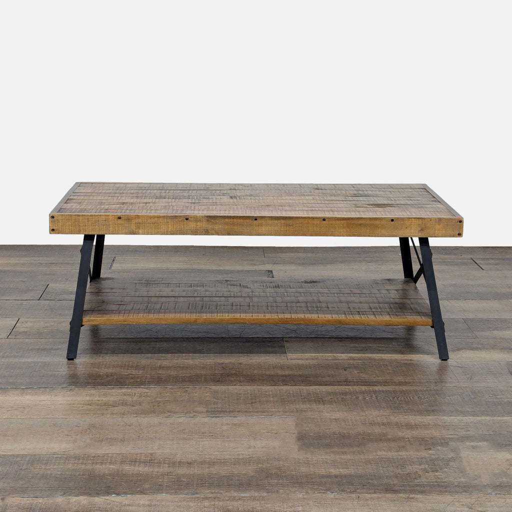 Front view of a Reperch coffee table with a planked wood top and shelf on a black metal frame.