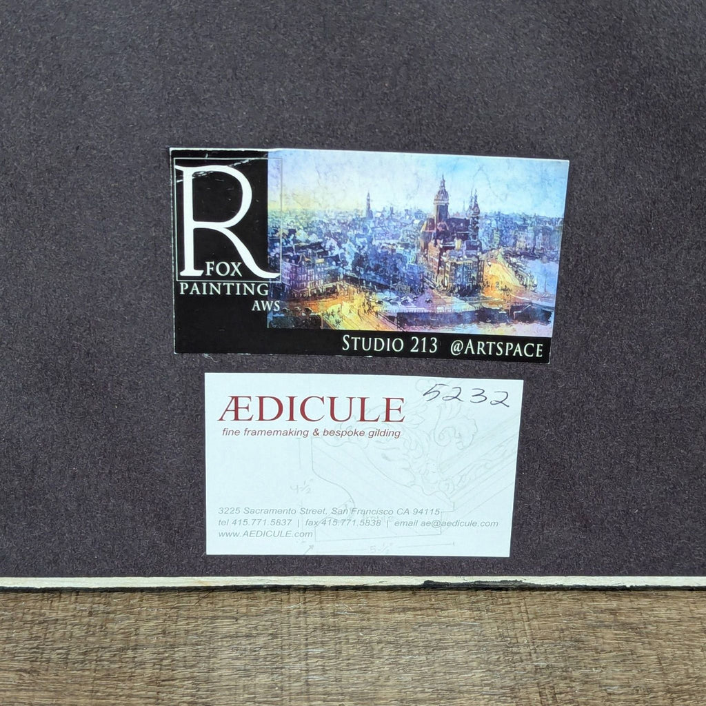 2. Close-up of painting's back showing Ryan Fox Painting and Ædicule custom framing studio labels.