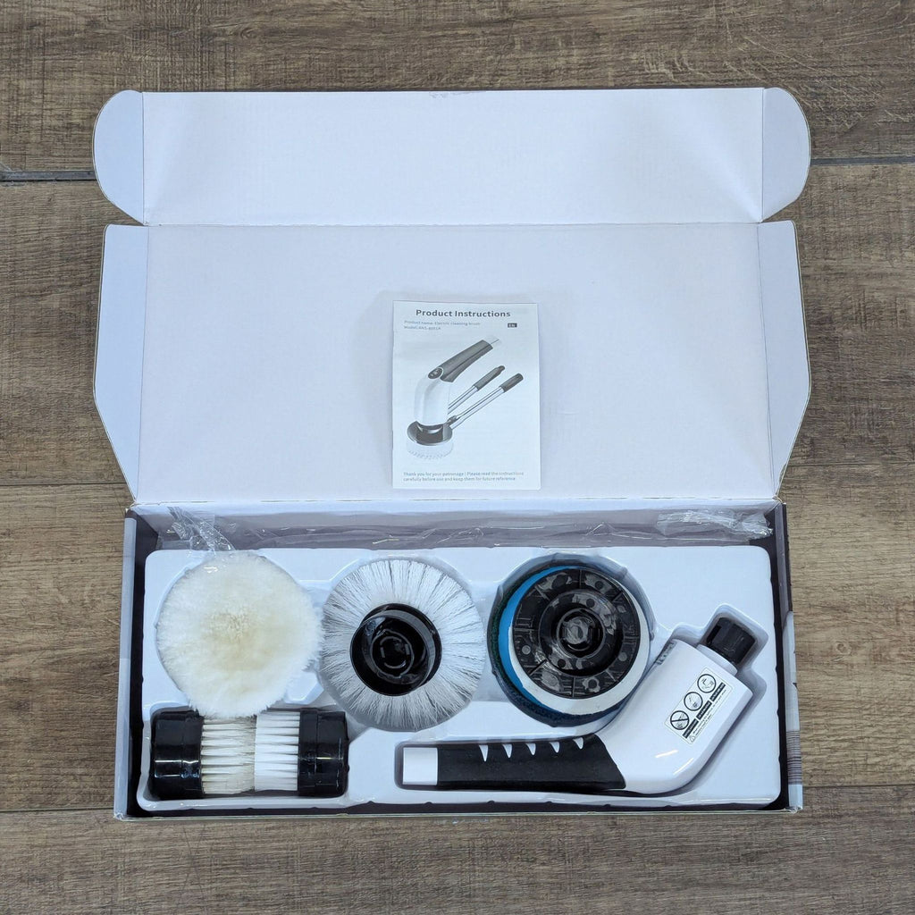 2. Box contents of the YKYI ANS-8051A electric cleaning brush, including brush heads and user manual.  