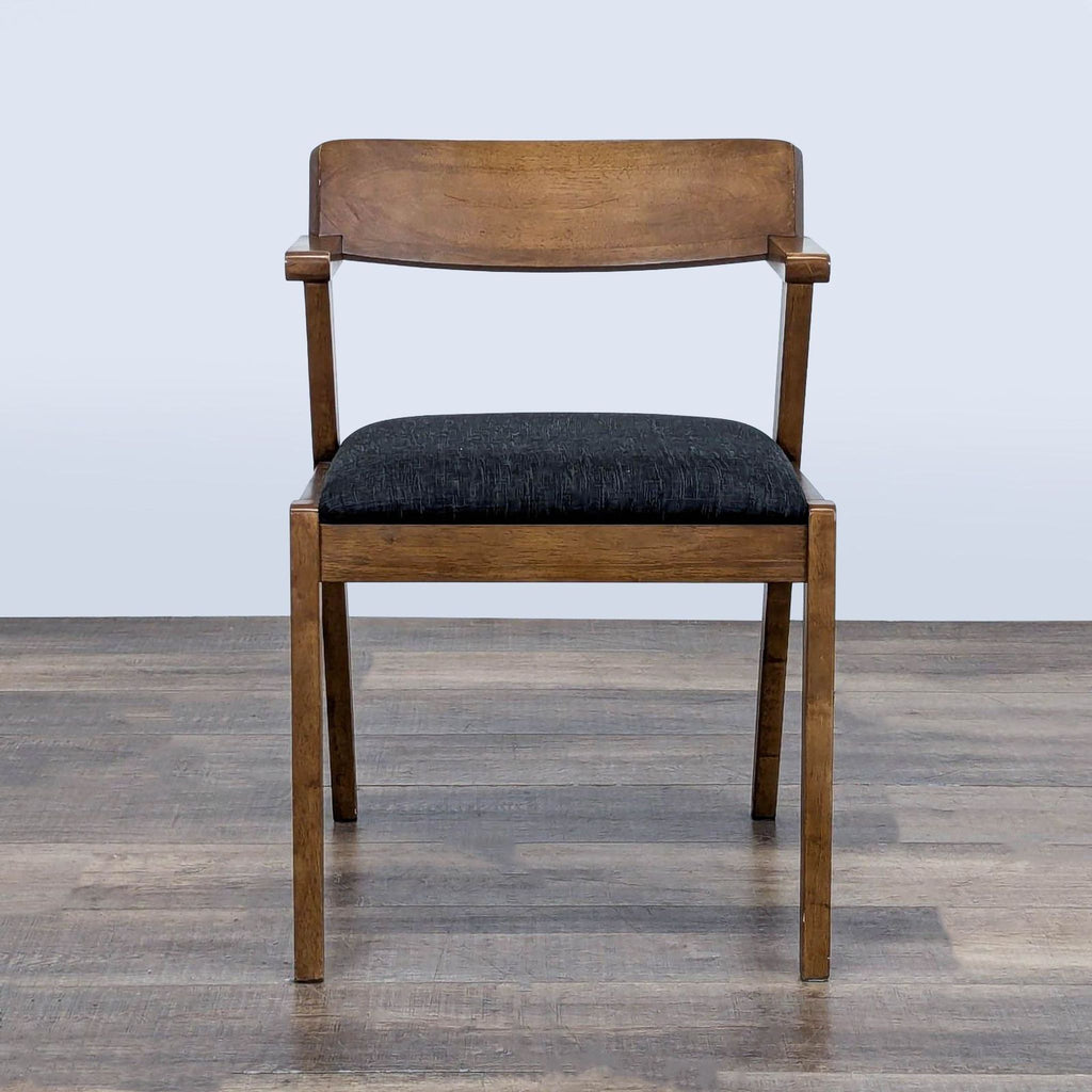 2. Front view of Article Zola dining chair, licorice color, solid wood construction, black padded foam seat.