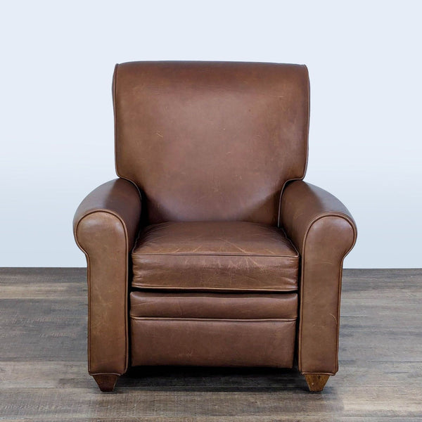 1. Brown leather Barcalounger lounge chair with rolled arms, seen from the front, on a wood floor.