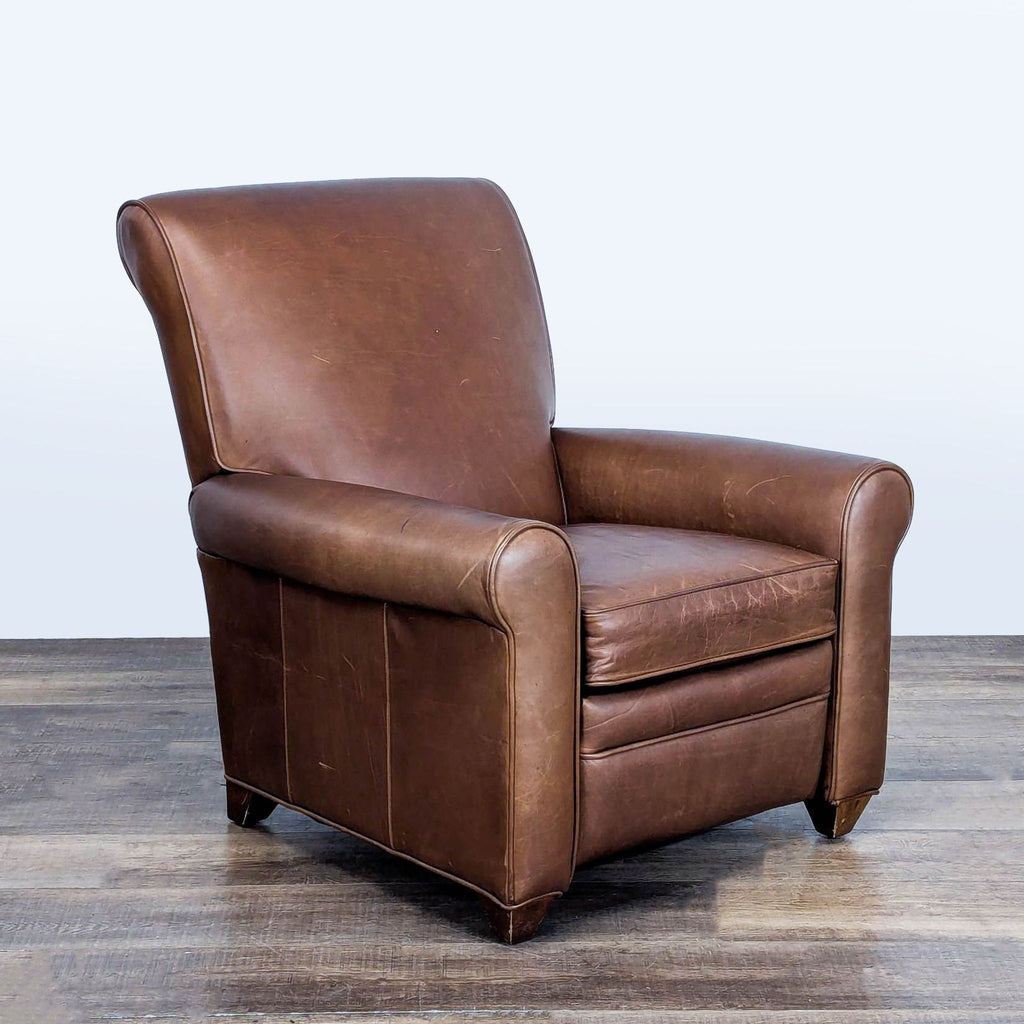 3. Angled view of a genuine brown leather Barcalounger with rolled arms and plush seat for lounging.