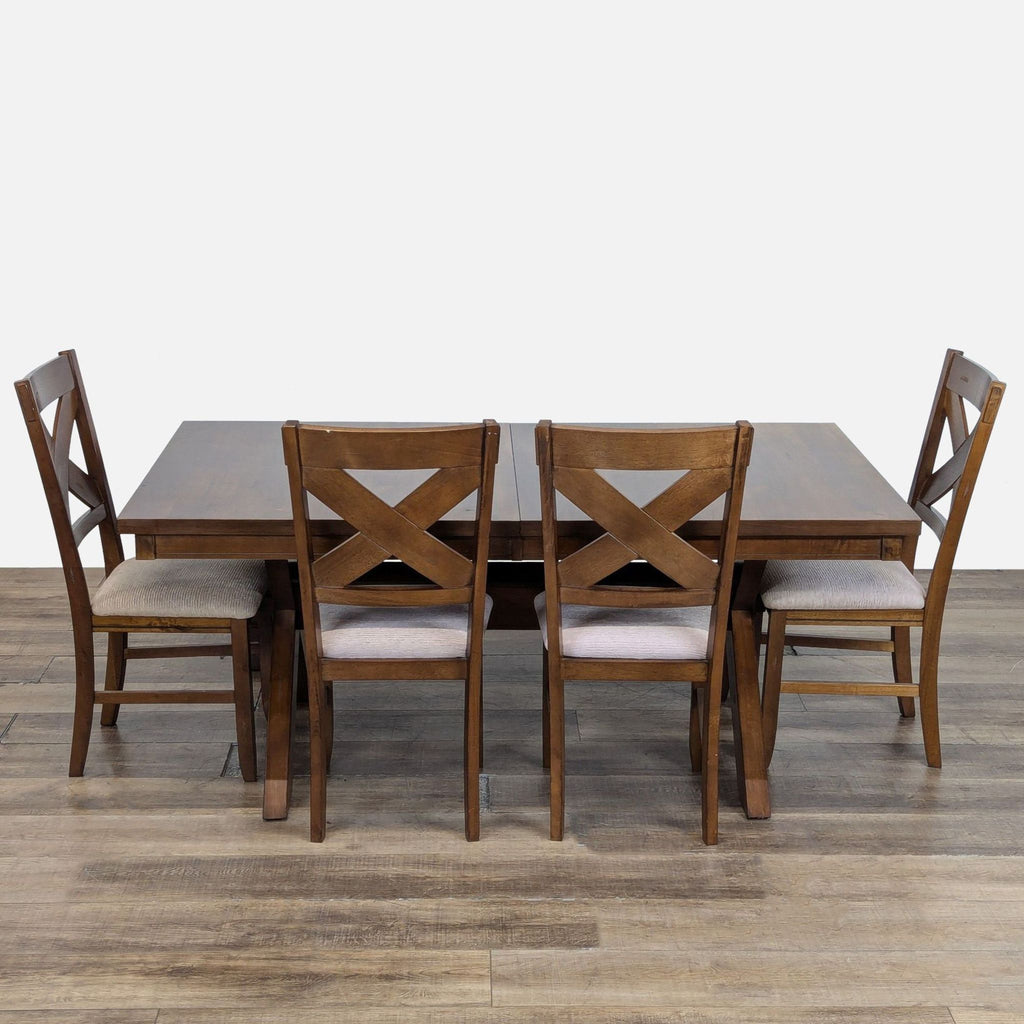 3. Dining set by Roundhill Furniture featuring four matching wood chairs with cushioned seats around the table.