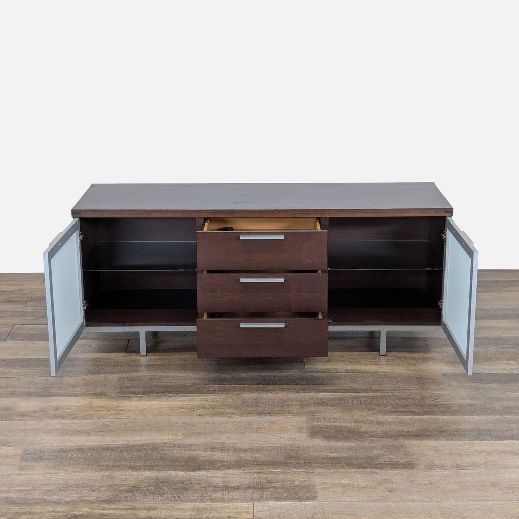 2. Sideboard by Calligaris featuring open frosted glass doors, exposed shelves, and three open central drawers.
