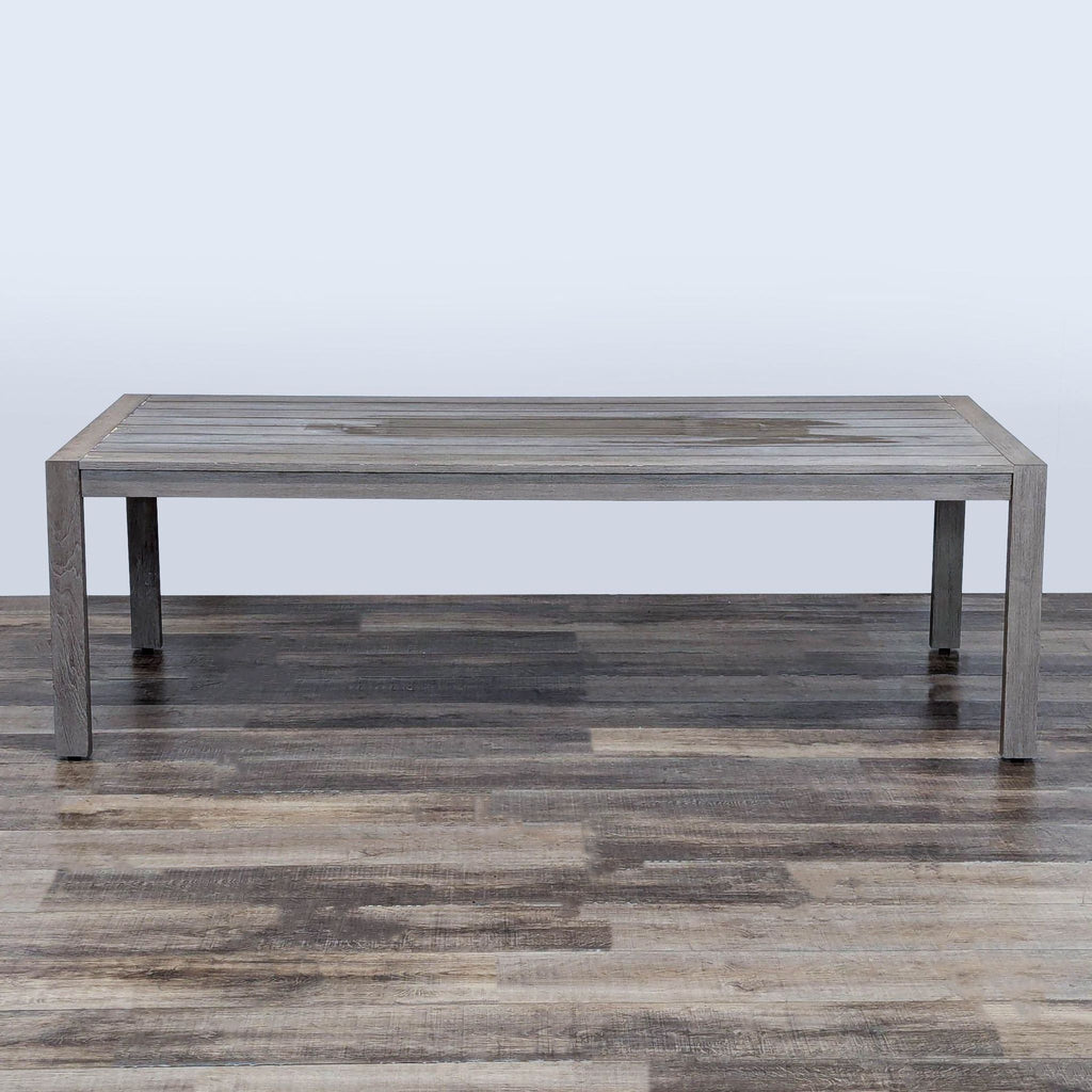 1. Weathered teak table with planked top by Restoration Hardware, rectangular design, placed on wood floor.