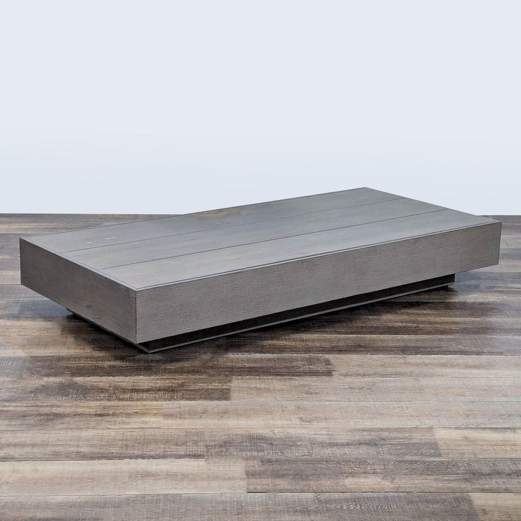1. Rectangular Restoration Hardware table made of solid teak with a weathered finish, shown on wood flooring.  