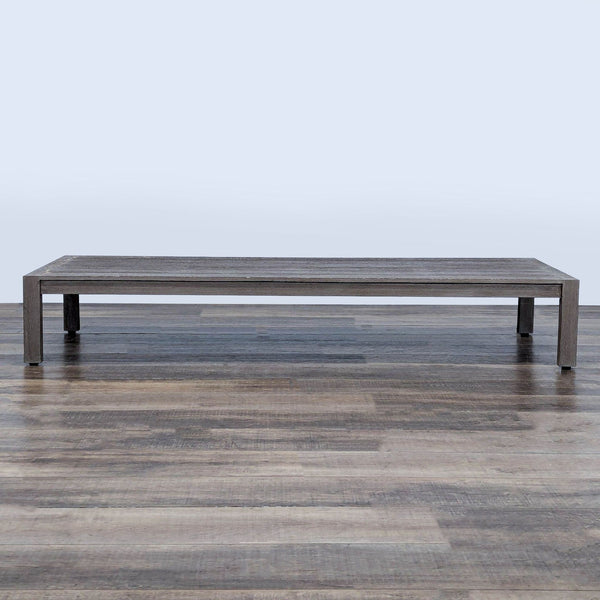 1. Rectangular weathered teak table with a plank top by Restoration Hardware, set on a wooden floor.