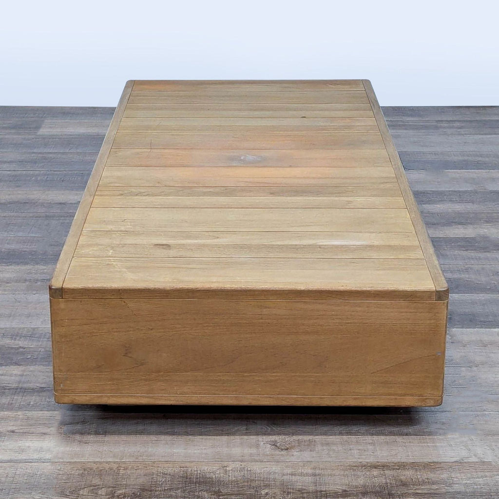 2. Low-profile teak table with a horizontal plank surface, categorized under tables by Restoration Hardware.