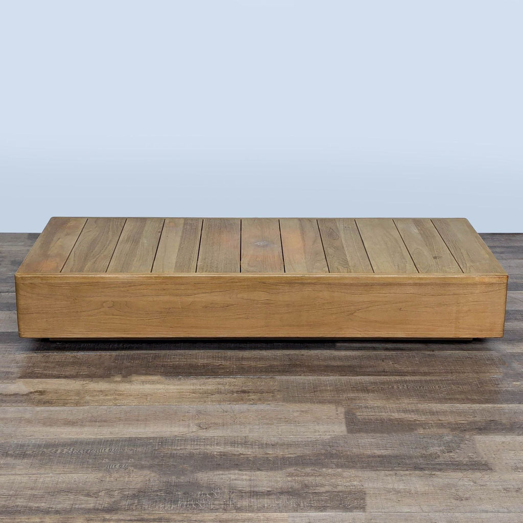 1. Rectangular solid teak table with a plank top from Restoration Hardware, displayed on wooden flooring.