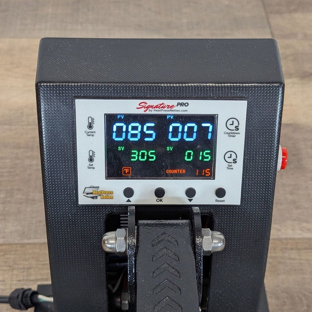 Close-up of Heat Press Nation control panel showing time and temperature digital gauge for precise adjustments.  