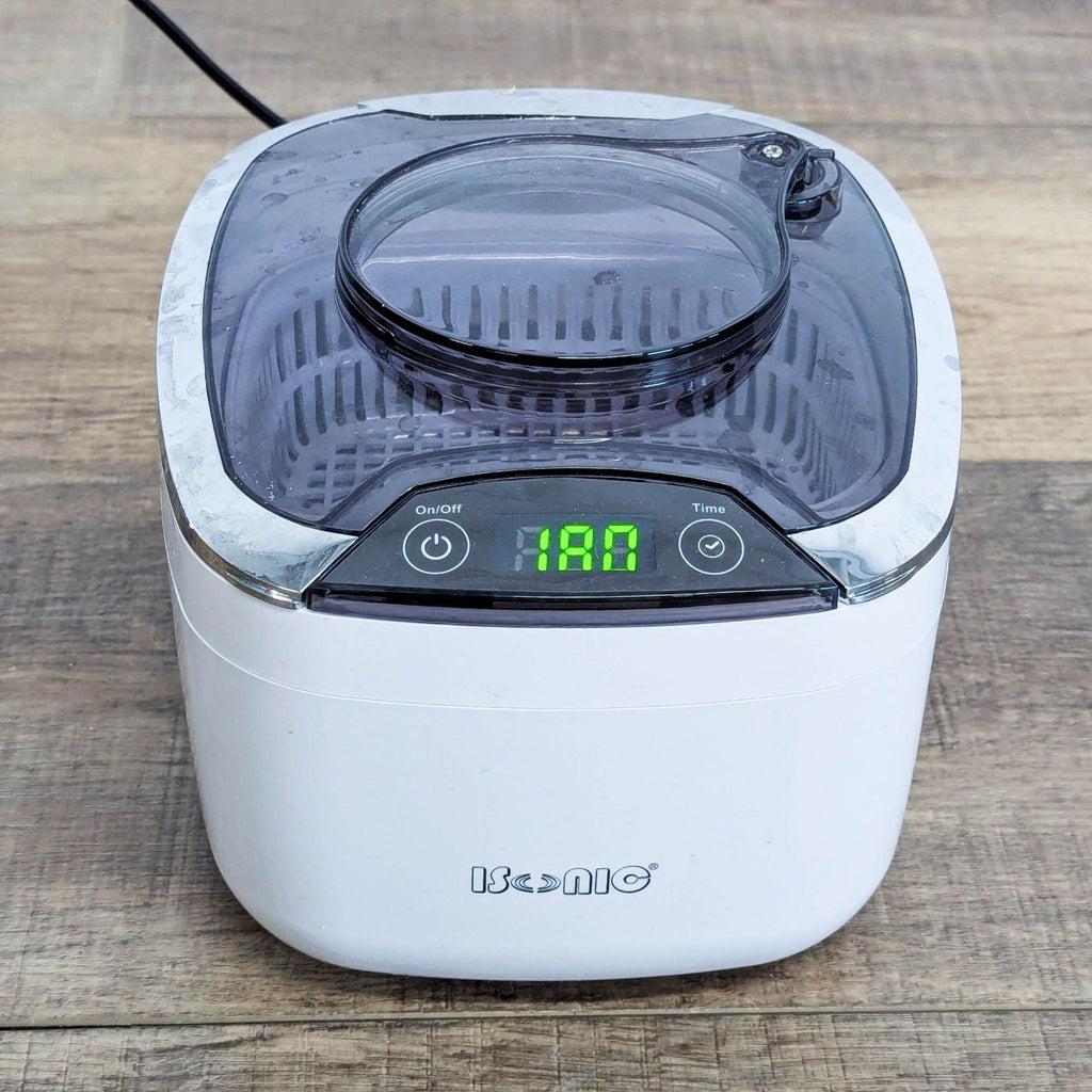 1. iSonic ultrasonic cleaner with digital controls for cleaning jewelry, eyeglasses, and small items, compact design.