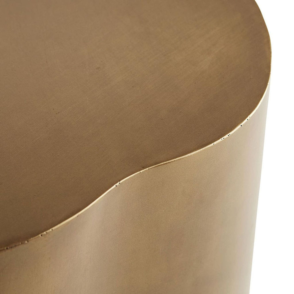 Detail shot of the smooth, contoured edge and lacquered finish on an Arteriors Home fiberglass coffee table.