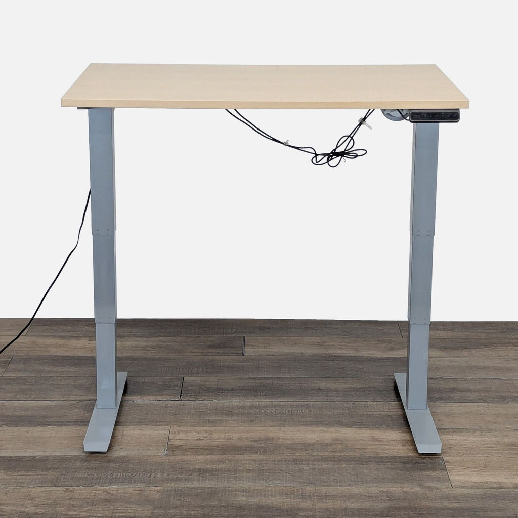 2. Tüv Rheinland adjustable desk, standing-height, programmable controls, with modern gray legs and wires visible.  