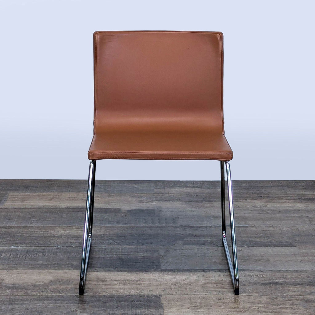 1. Front view of the Ikea Bernhard Chair with a leather seat and chrome-plated underframe, designed by Ola Wihlborg.