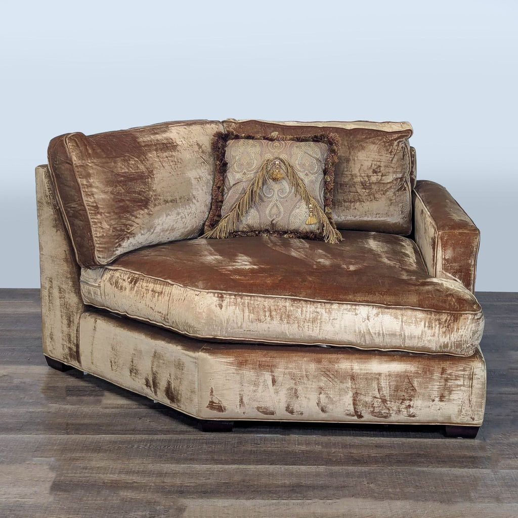 1. Velvet corner chair by Executive Seating Corp. in beige and brown, topped with a decorative fringed pillow.  