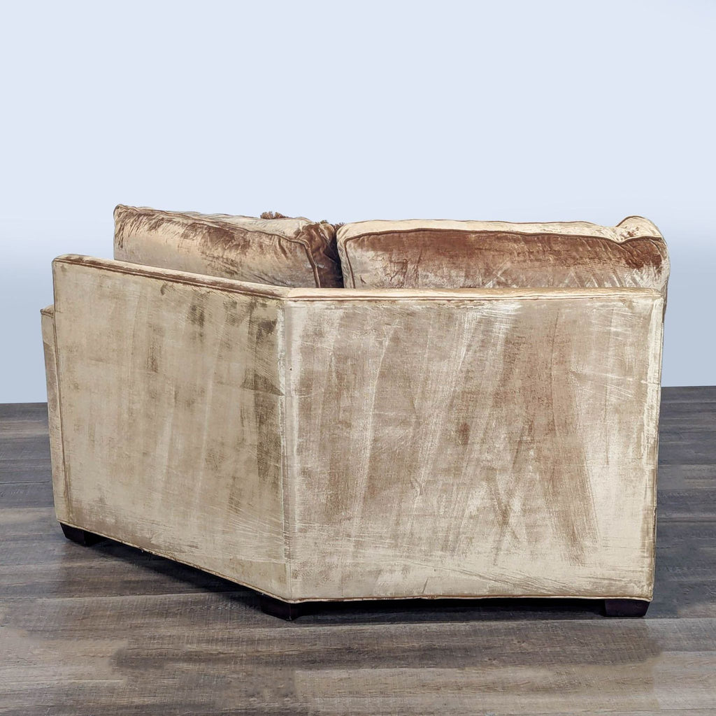 3. Rear view of a beige and brown velvet chair by Executive Seating Corp., showing its angled backing.