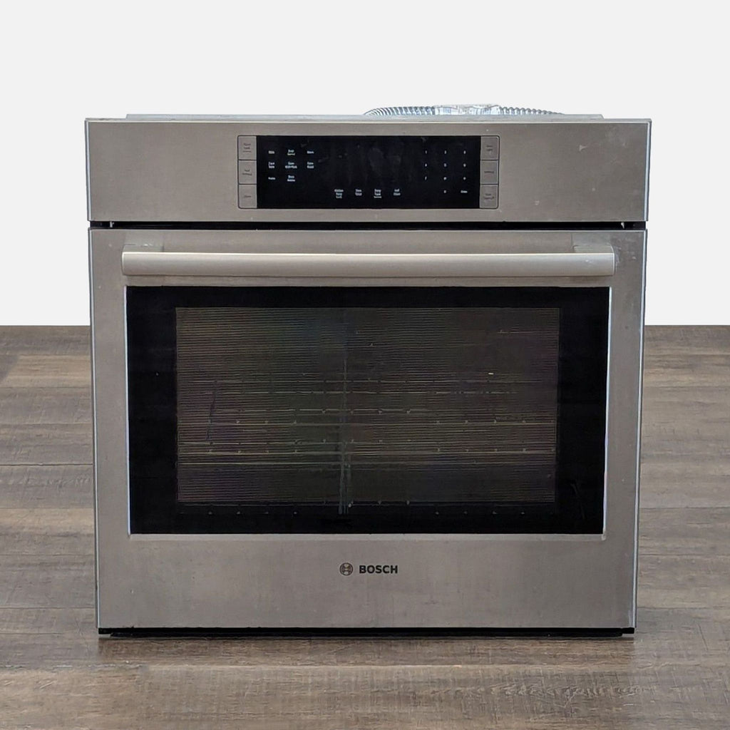 1. Bosch built-in electric oven with stainless steel finish, large front window, and touch controls for modern kitchens.
