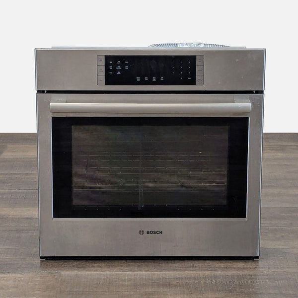 1. Bosch built-in electric oven with stainless steel finish, large front window, and touch controls for modern kitchens.