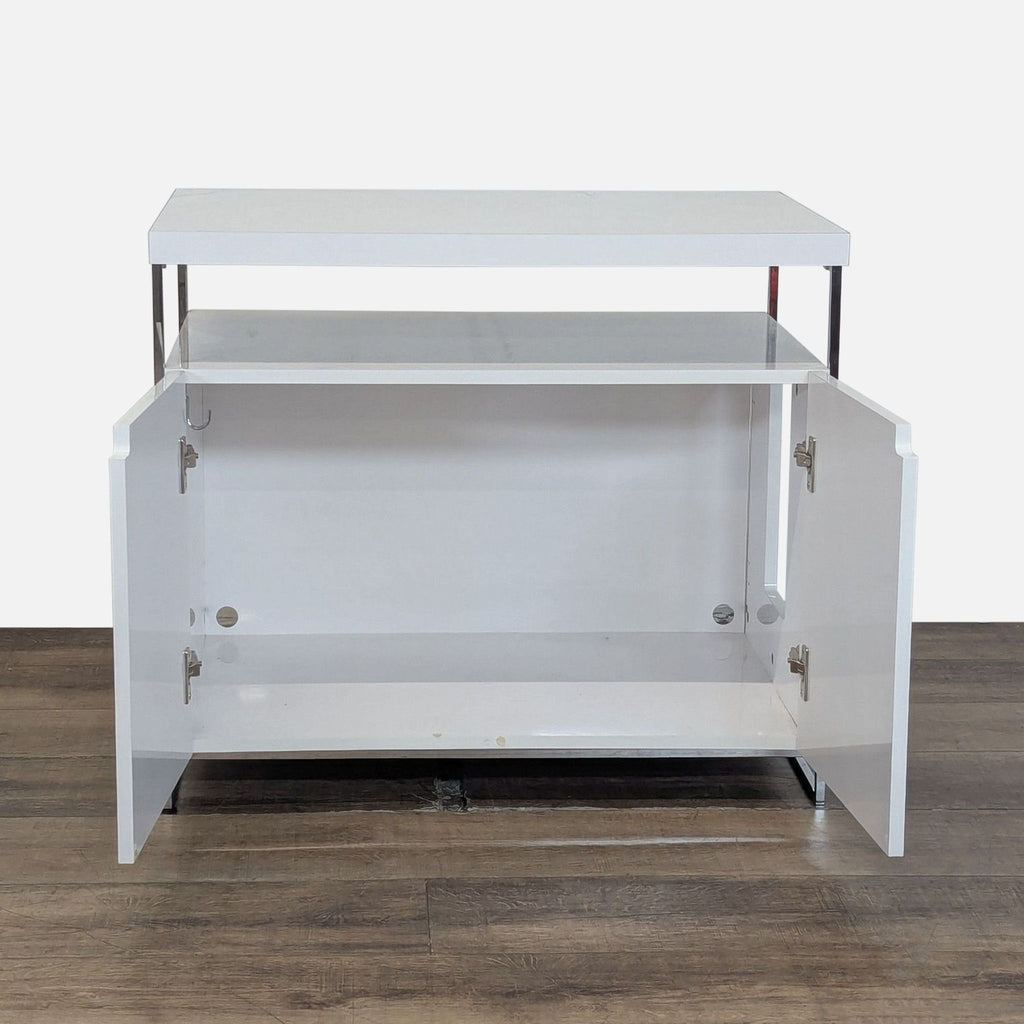 2. Reperch cabinet with open doors, showing spacious interior storage and minimalist white design.
