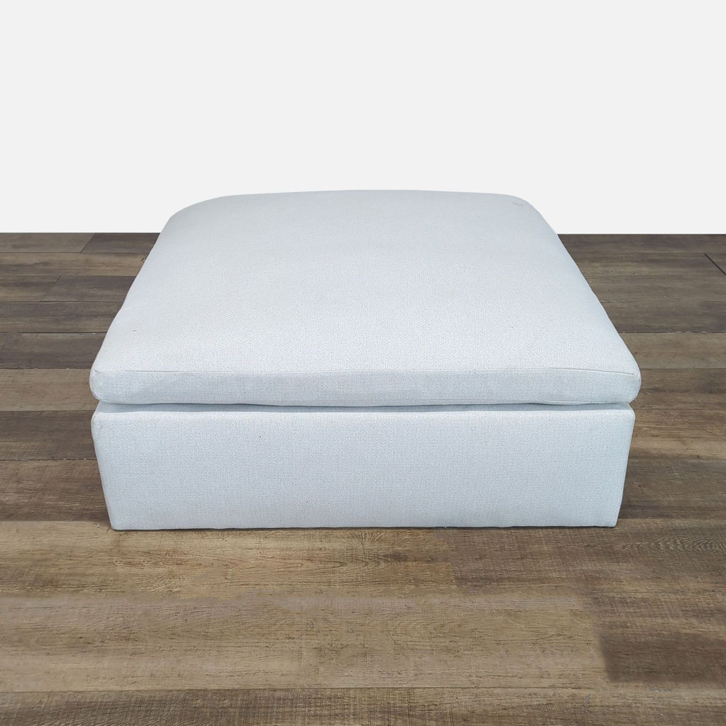 2. Front view of a modern, light grey Reperch ottoman from the Stools, Ottomans & Benches category.  