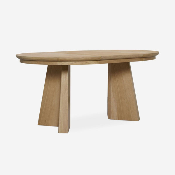 1. Oak dining table by Lulu and Georgia with two angular legs and a cross-pedestal-inspired base.  