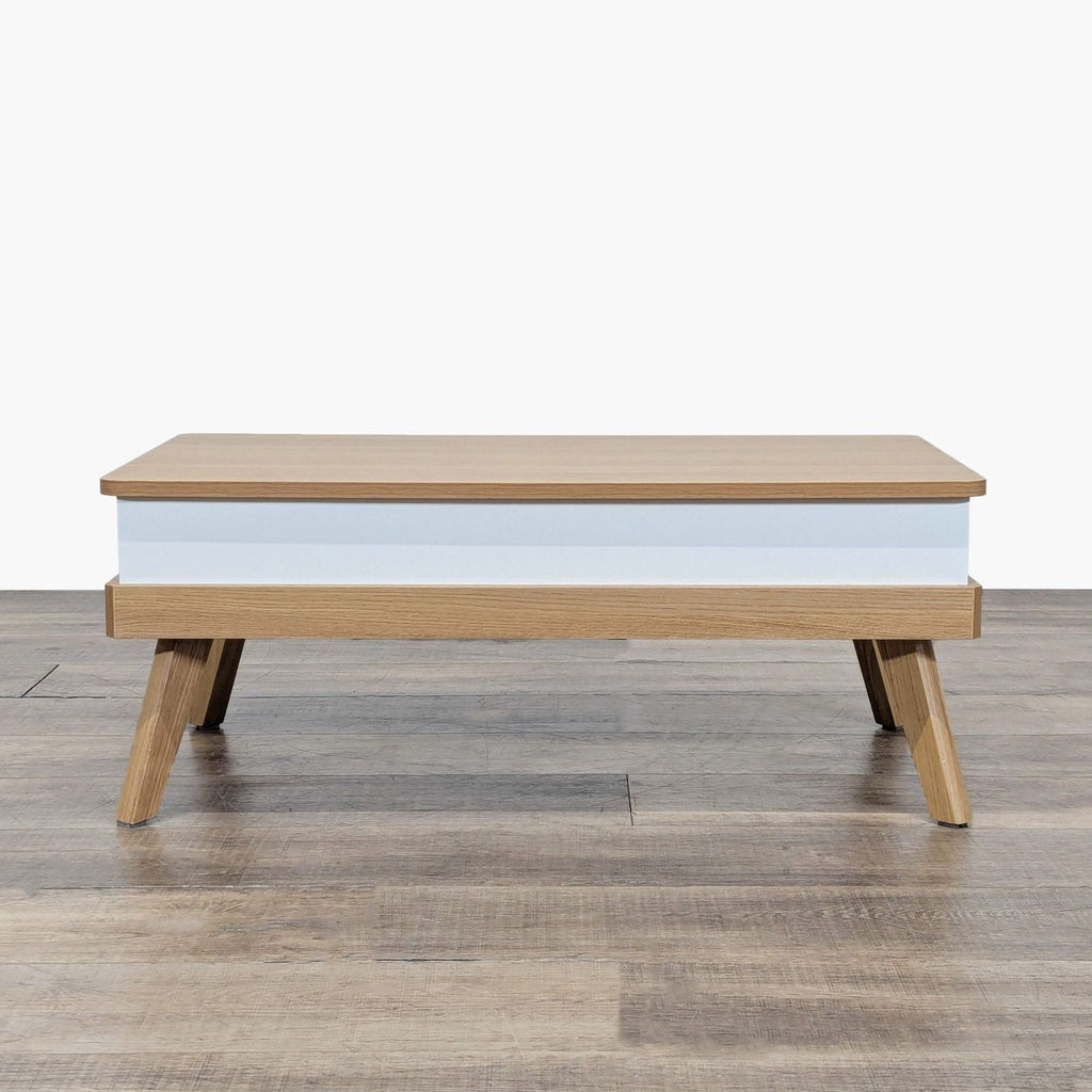 1. Reperch coffee table with light wood finish, white base accent, and angled legs on wood flooring.