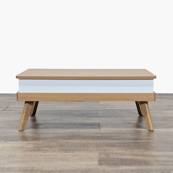 1. Reperch coffee table with light wood finish, white base accent, and angled legs on wood flooring.