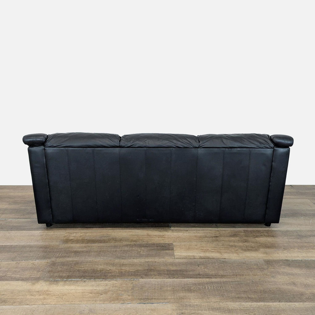 3. Rear view of Krause’s Sofa Factory black leather three-seat sleeper sofa with panel detailing.