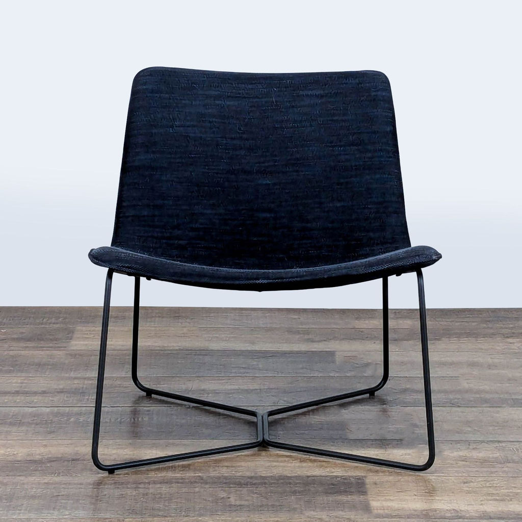 1. West Elm lounge chair with low-slung, curved seat and back on a powder-coated steel frame, front view.