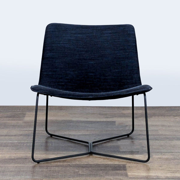 1. West Elm lounge chair with low-slung, curved seat and back on a powder-coated steel frame, front view.