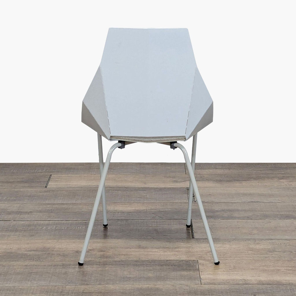 2. Single white Reperch dining chair with folded steel construction and Blu Dot pad, shown from the front.
