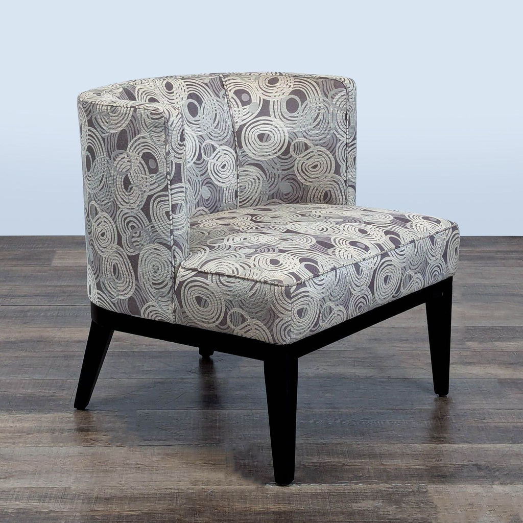 3. Angled view of Grayson lounge chair by Crate and Barrel, barrel-back design, swirl upholstery, wood base.