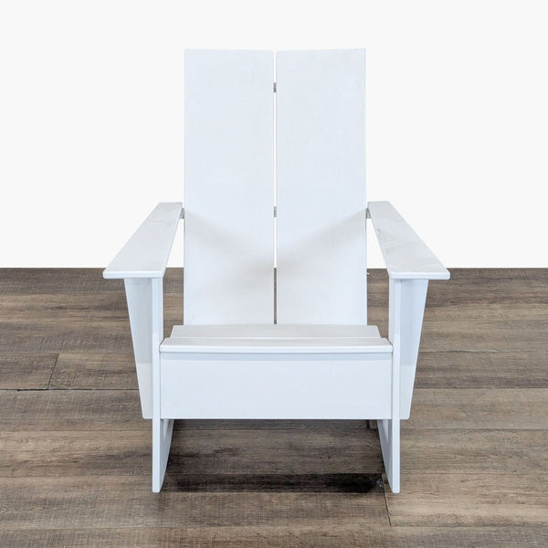 1. Front view of a white Room & Board HDPE chair, made with recycled plastics, on a wooden floor.