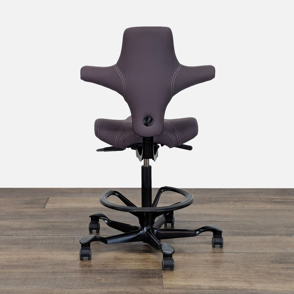 3. Rear view of a HAG H8106 ergonomic office chair, highlighting its distinctive shape and black base.