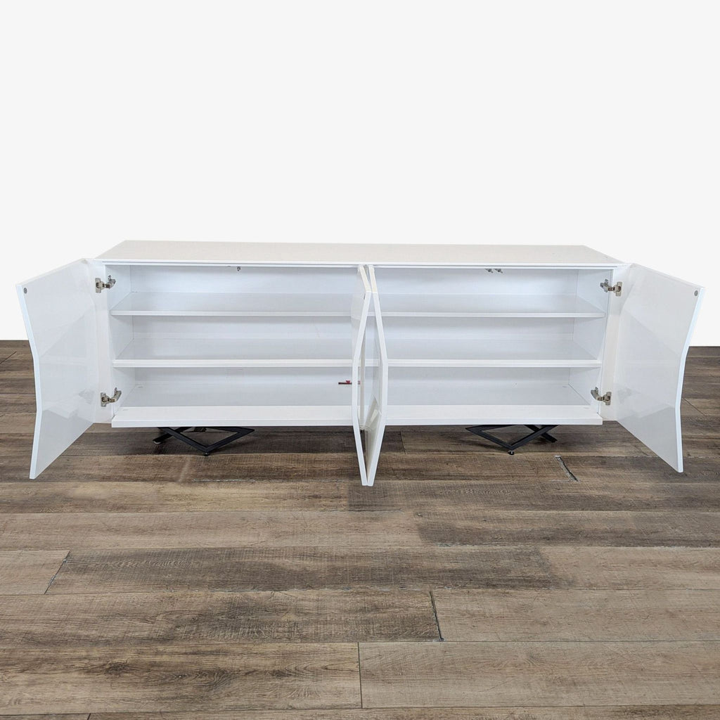 2. Interior of the Modrest sideboard showing four open doors and spacious shelving for storage.