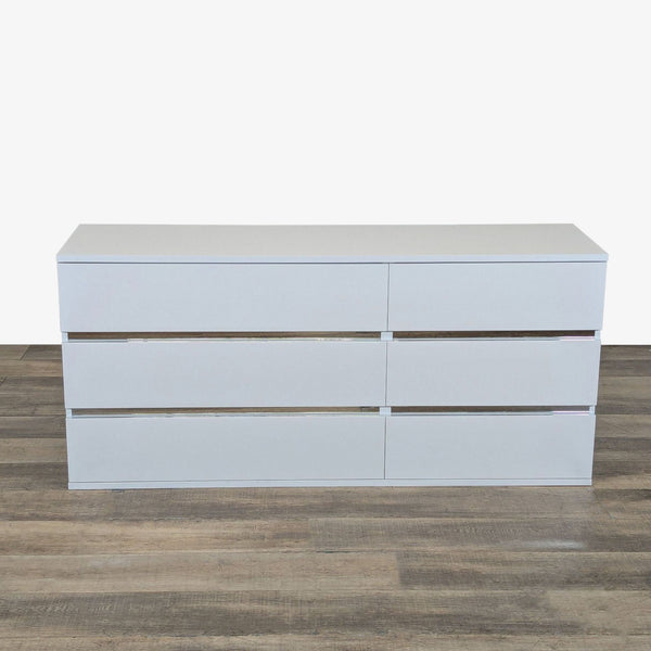 Front view of a Status brand glossy white large dresser with 6 drawers, modern design, made in Italy.