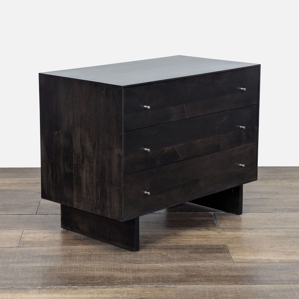 3. Handcrafted dark wood dresser from Room and Board, three-drawer design with clean lines, viewed from an angle.