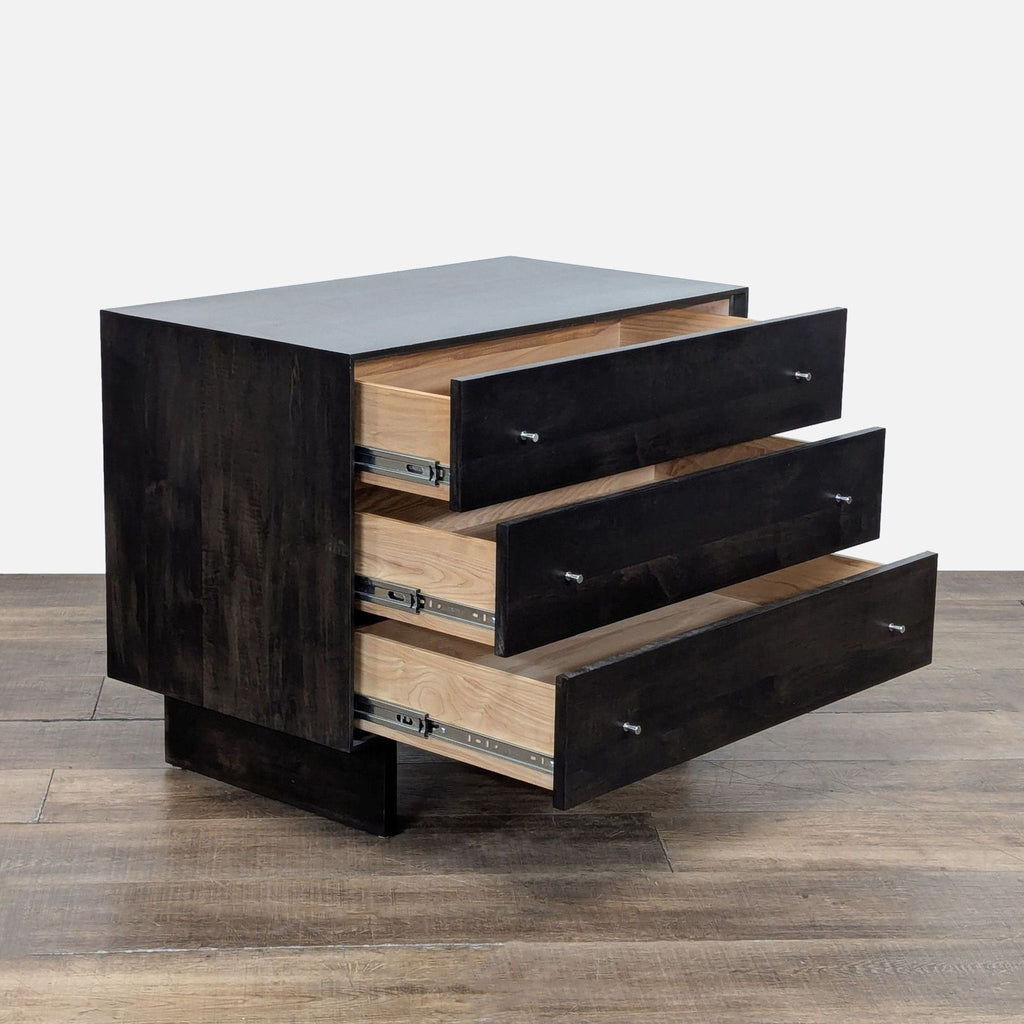 2. Room and Board charcoal wood dresser angled, showing all three spacious drawers open with metal hardware details.